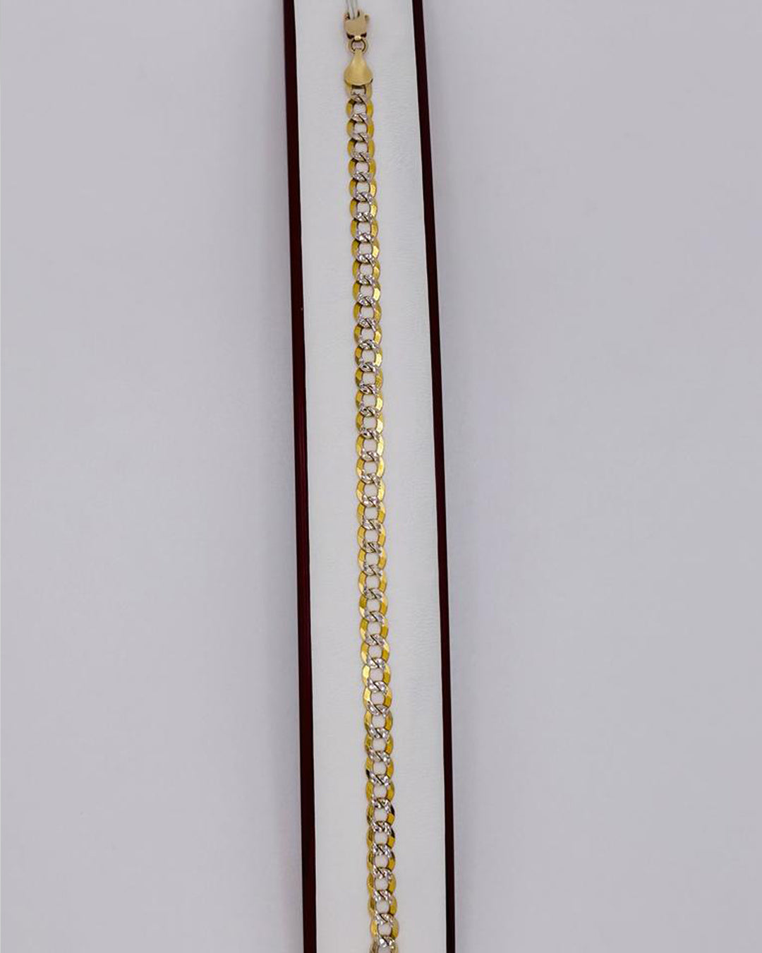 PULSERA ESTILO CUBANO EN DOS OROS