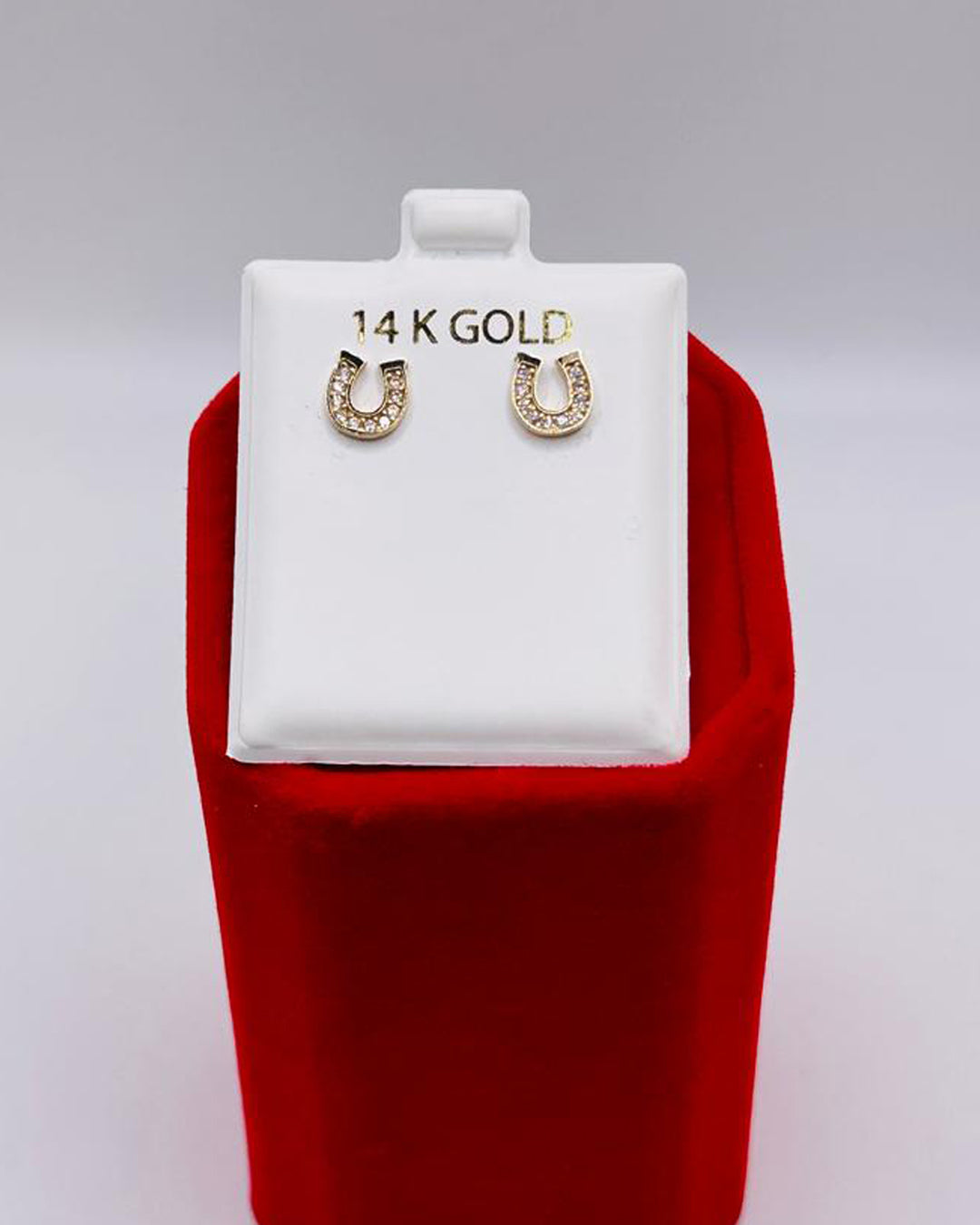 ARETES DE HERRADURA CON PIEDRAS BLANCAS